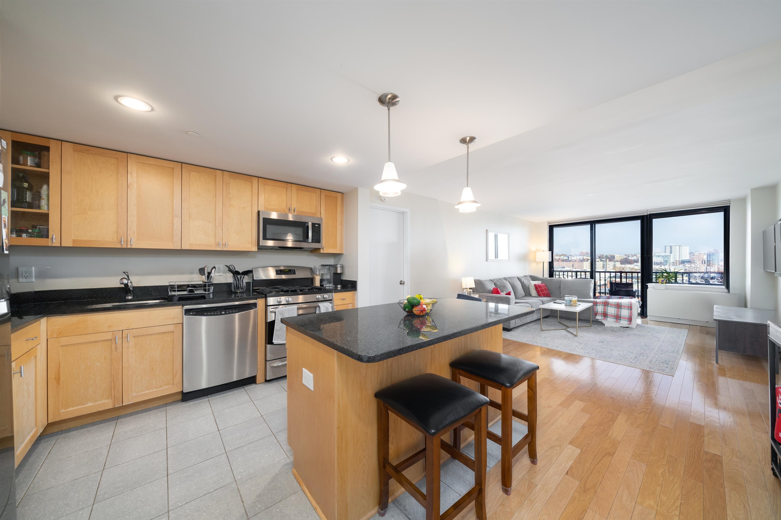 a kitchen with sink refrigerator and cabinets