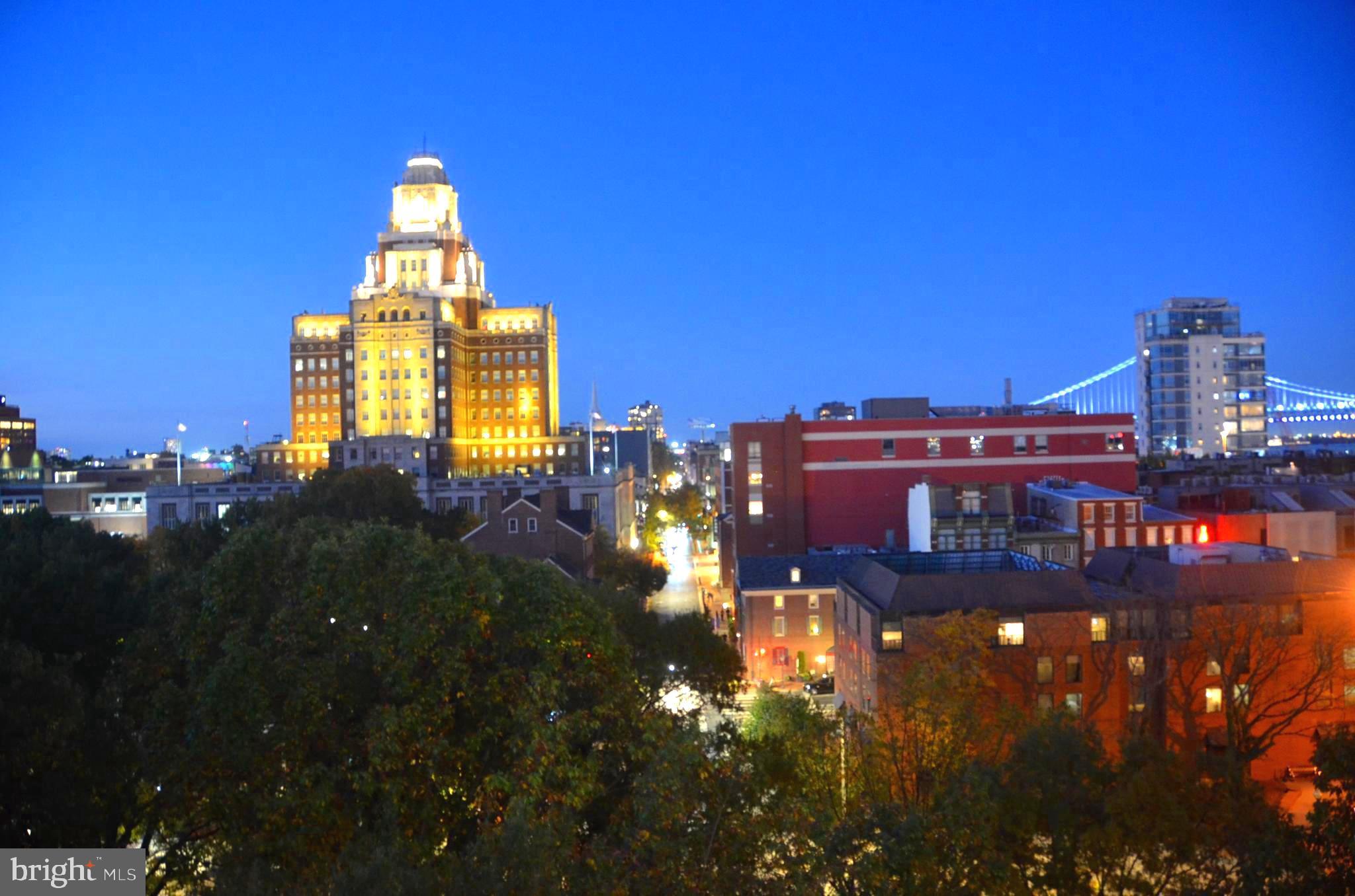 a view of a city with tall buildings