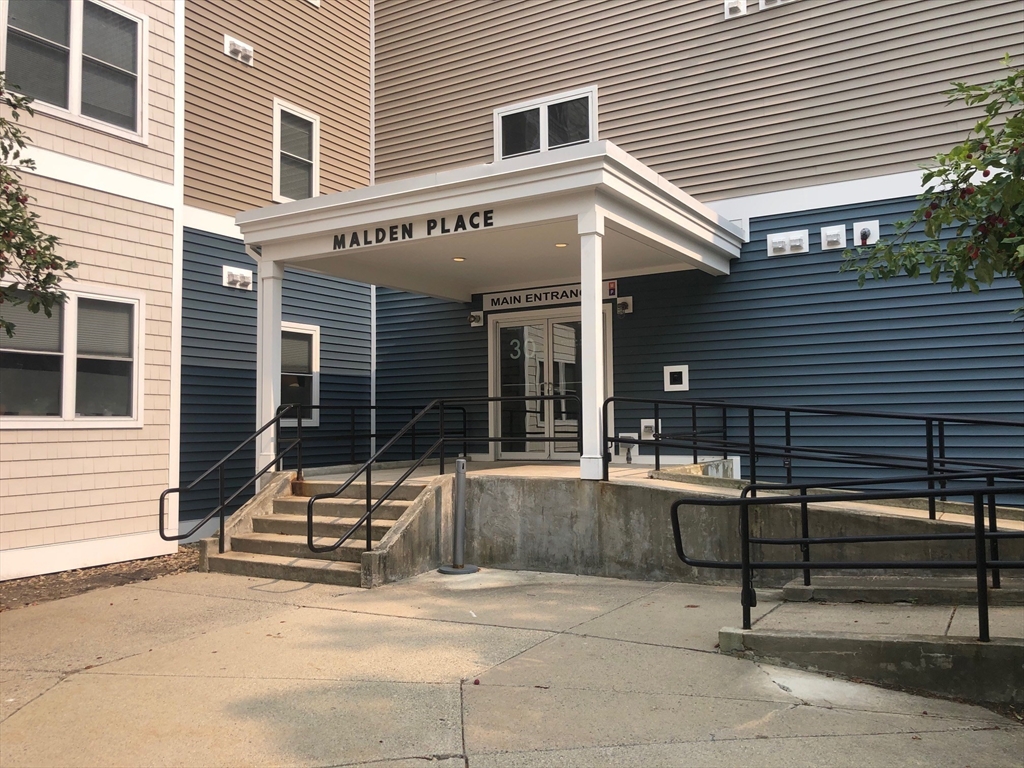 a view of house with outdoor seating area