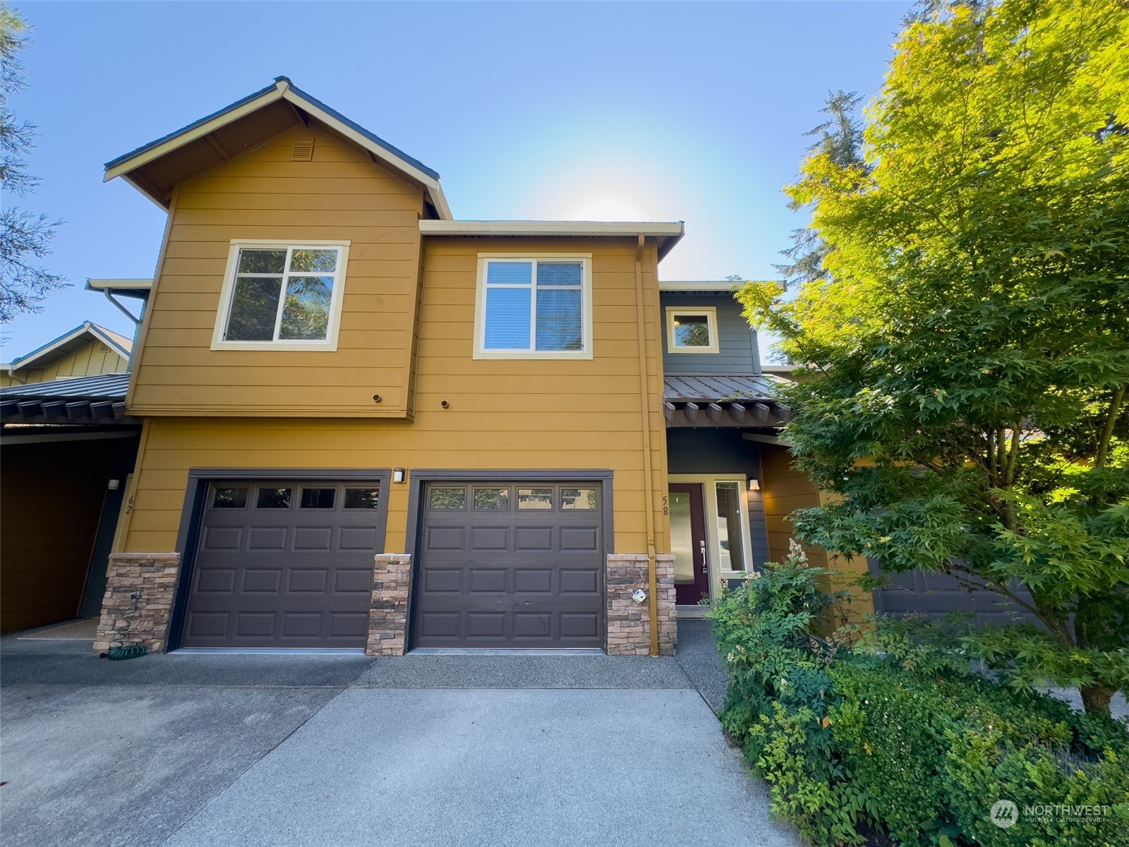 a front view of a house with garage