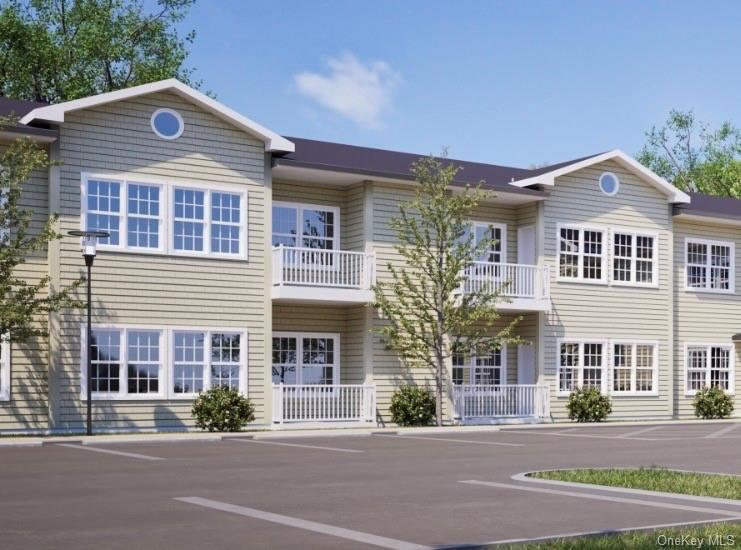 View of front of house with a balcony