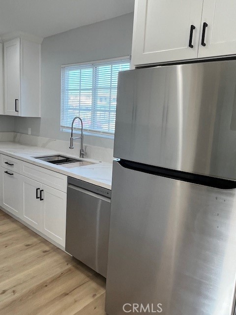 a view of a kitchen with a sink