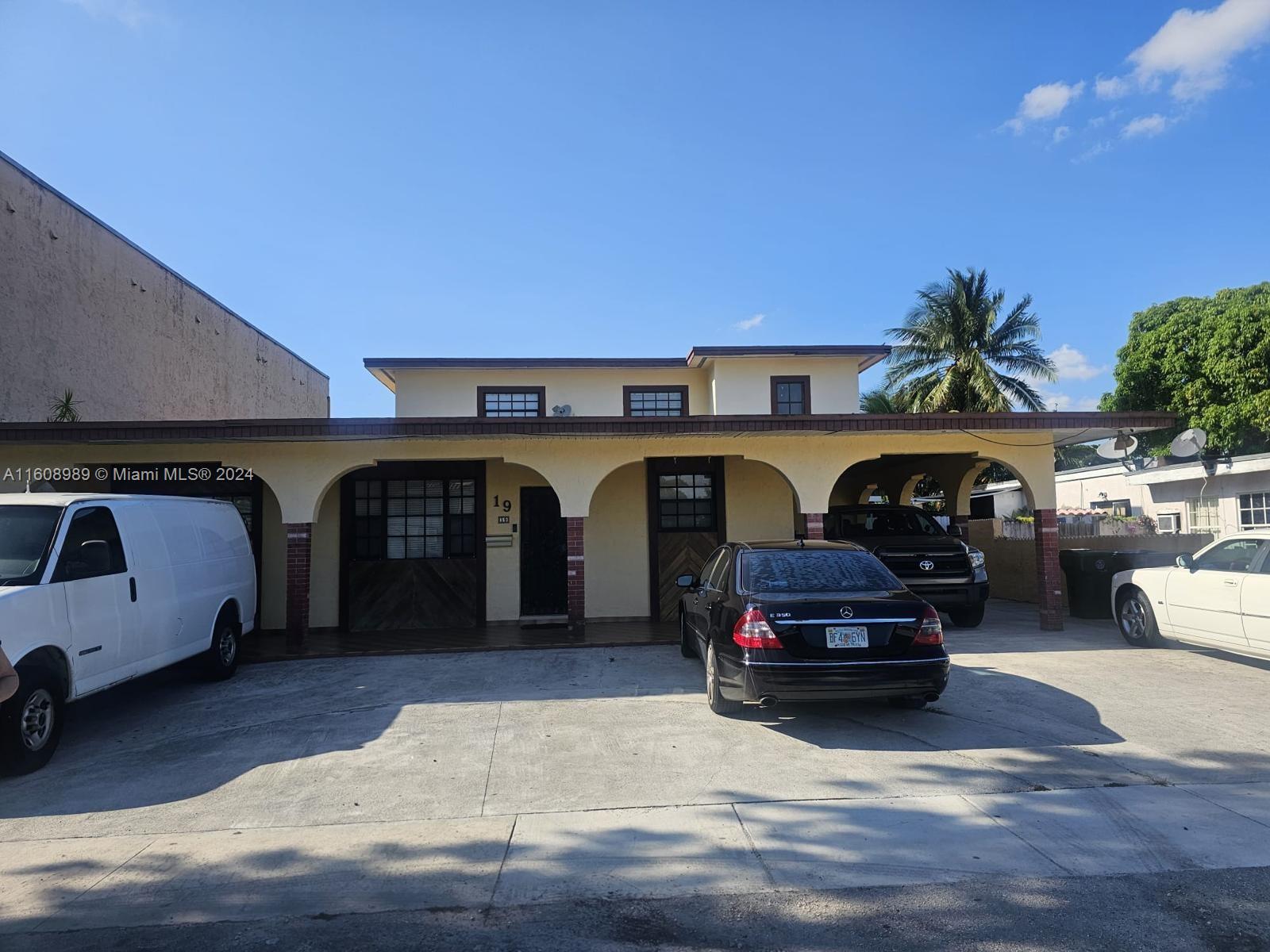 a front view of a house with parking space