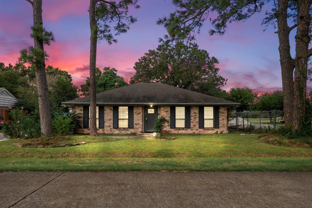 a front view of a house with a yard table and chairs