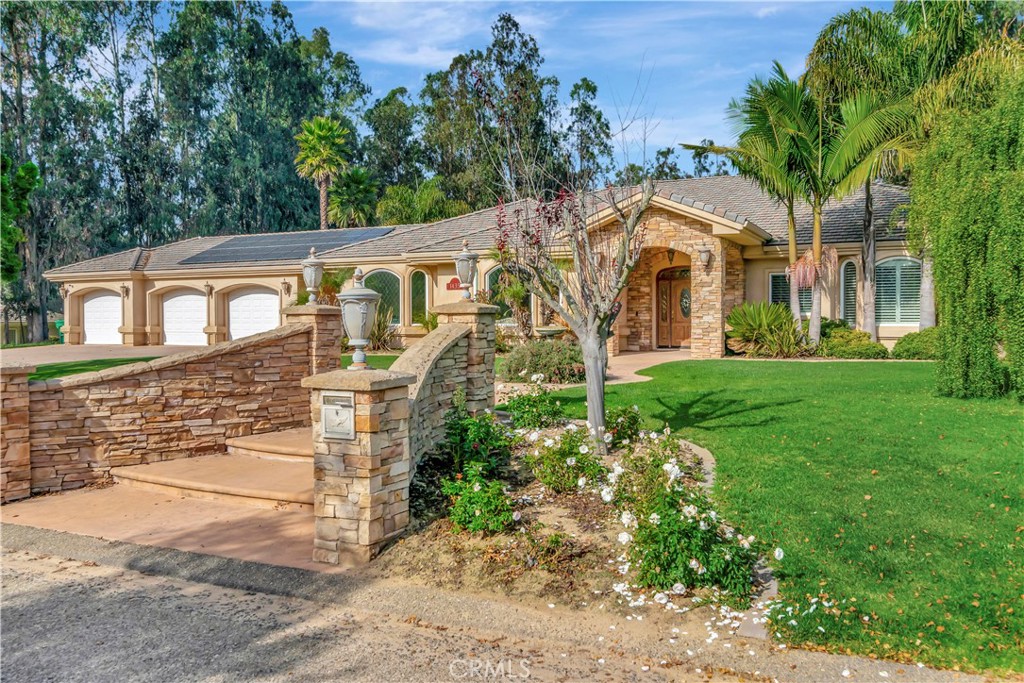 front view of a house with a yard