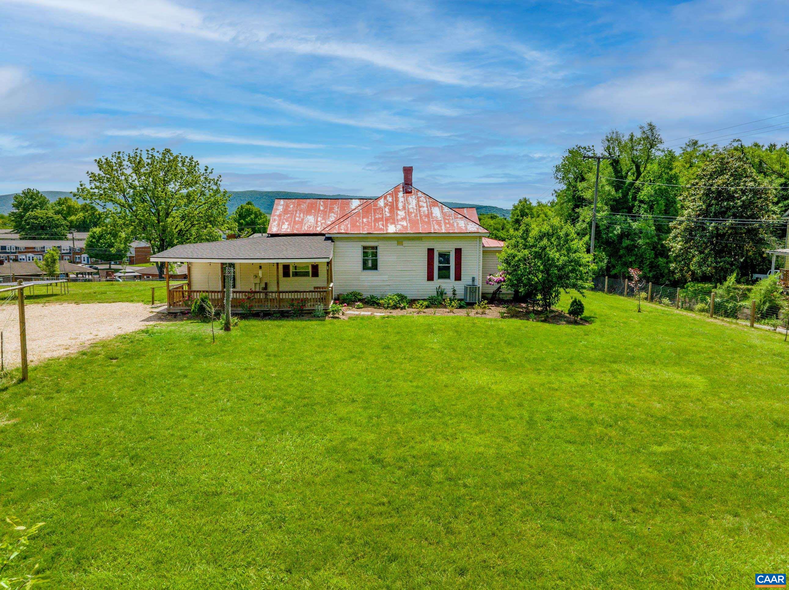 a view of a house with a big yard