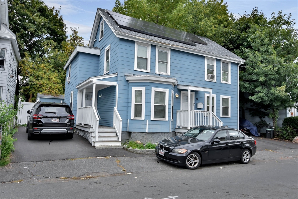 a car parked in front of a house