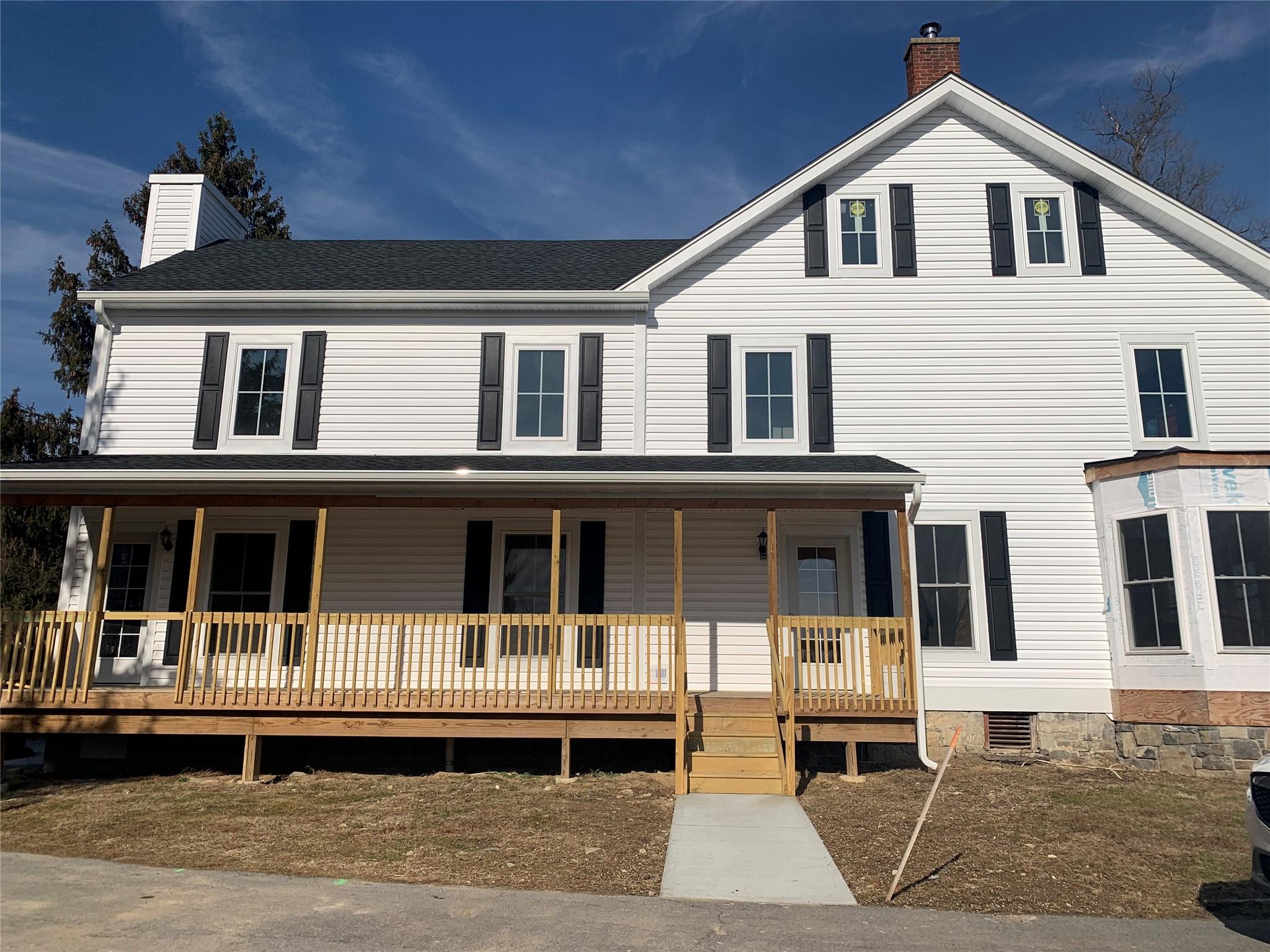 a front view of a house with a balcony