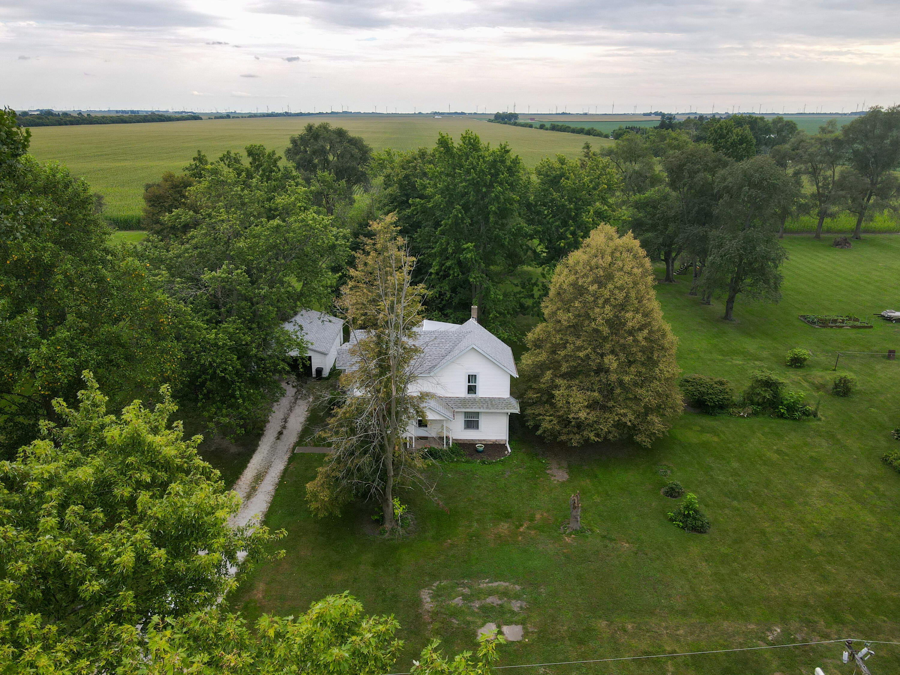 a aerial view of a house with a yard