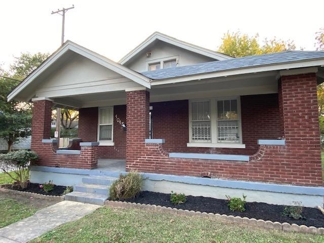 View of front of house with covered porch