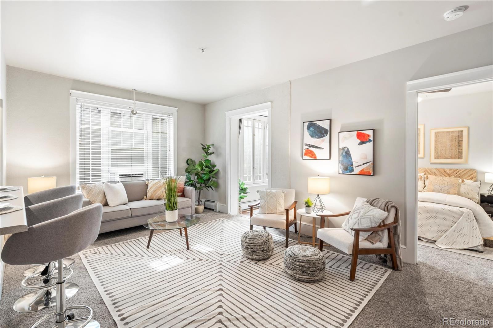 a living room with furniture or couch and a window