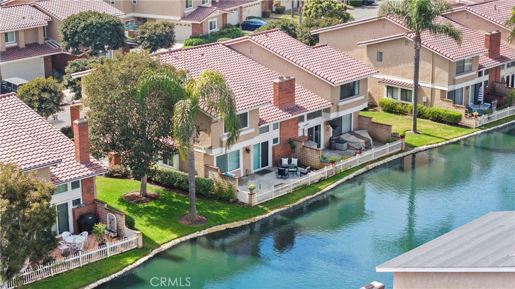 a view of a house with pool and sitting area