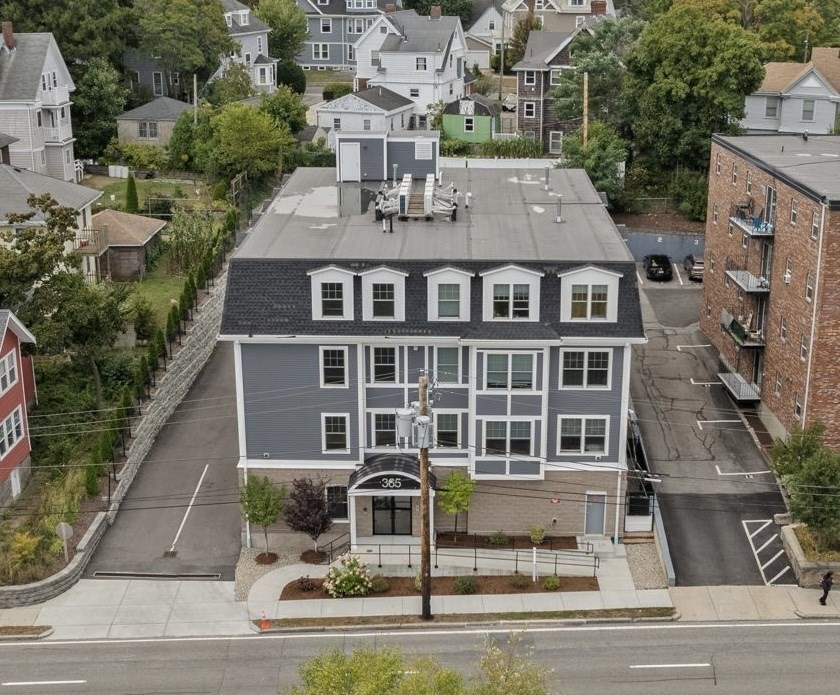 an aerial view of a brick building