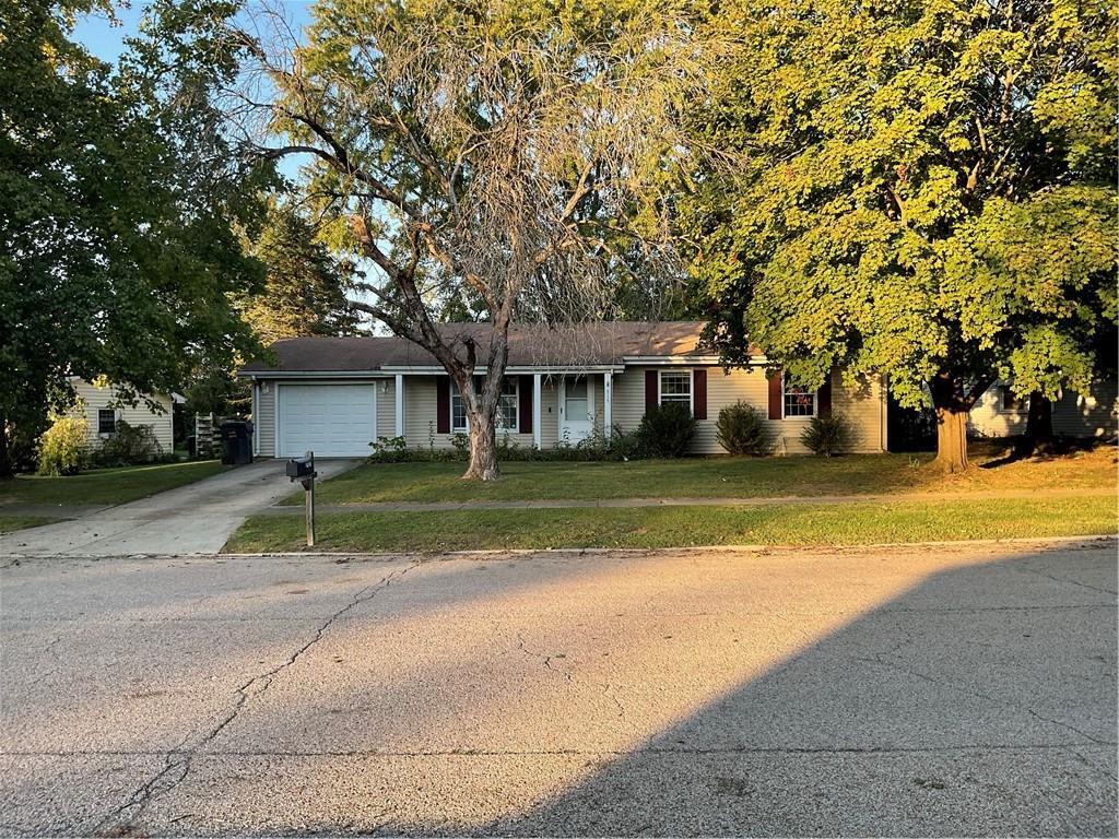 a view of house with outdoor space and tree s