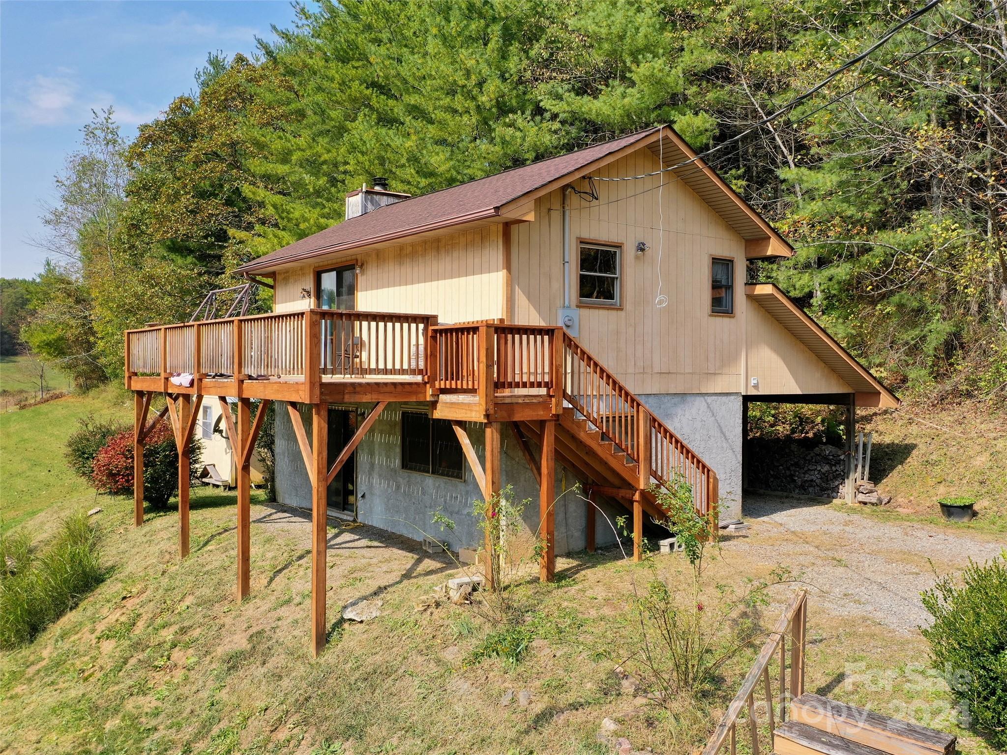 a view of a house with wooden stairs