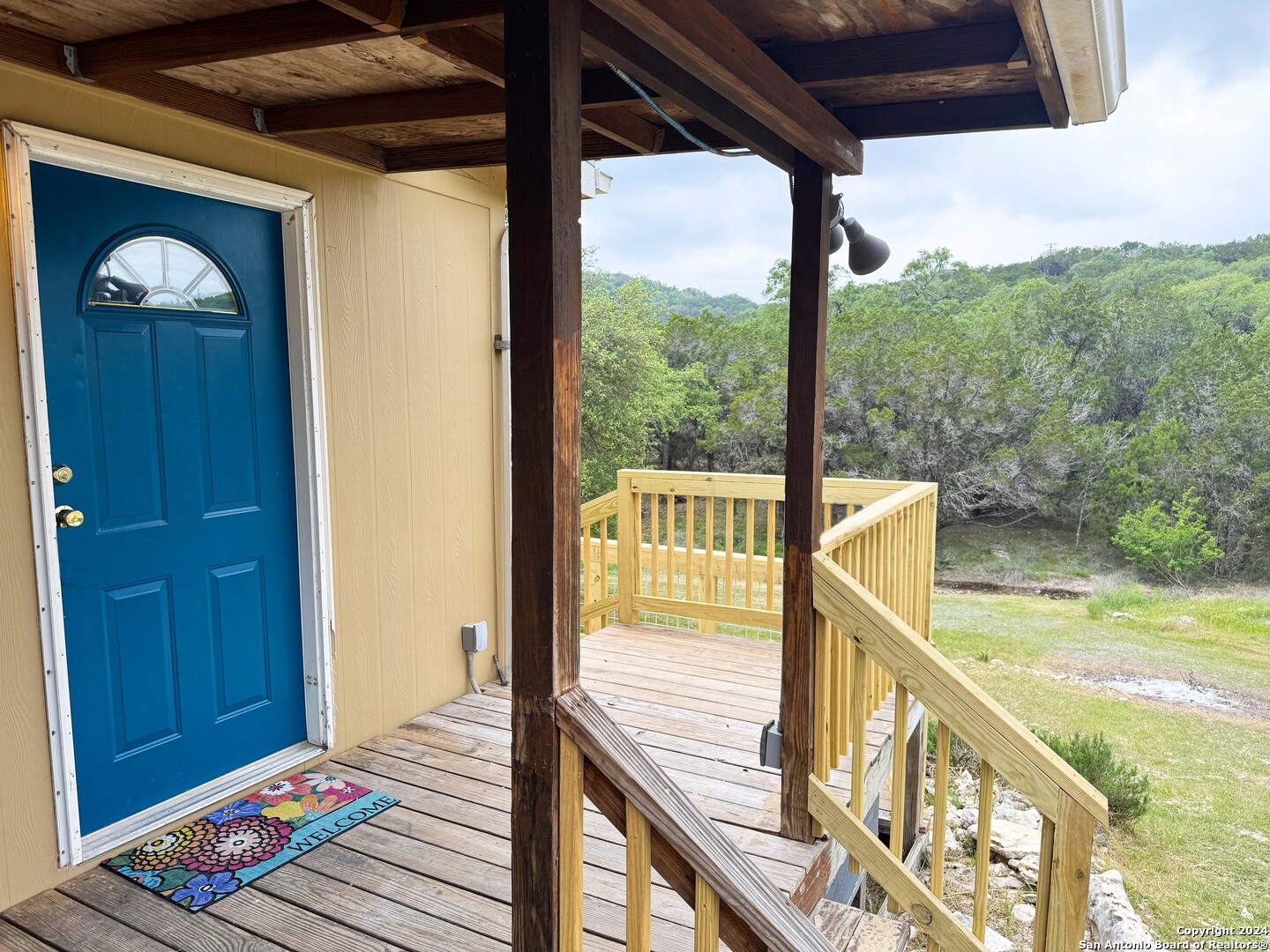 a view of balcony with wooden floor