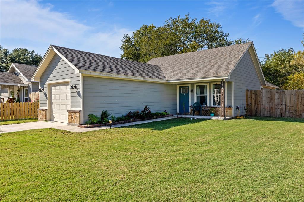 a front view of house with yard and seating area