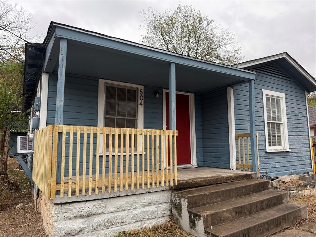 a side view of a house with a deck