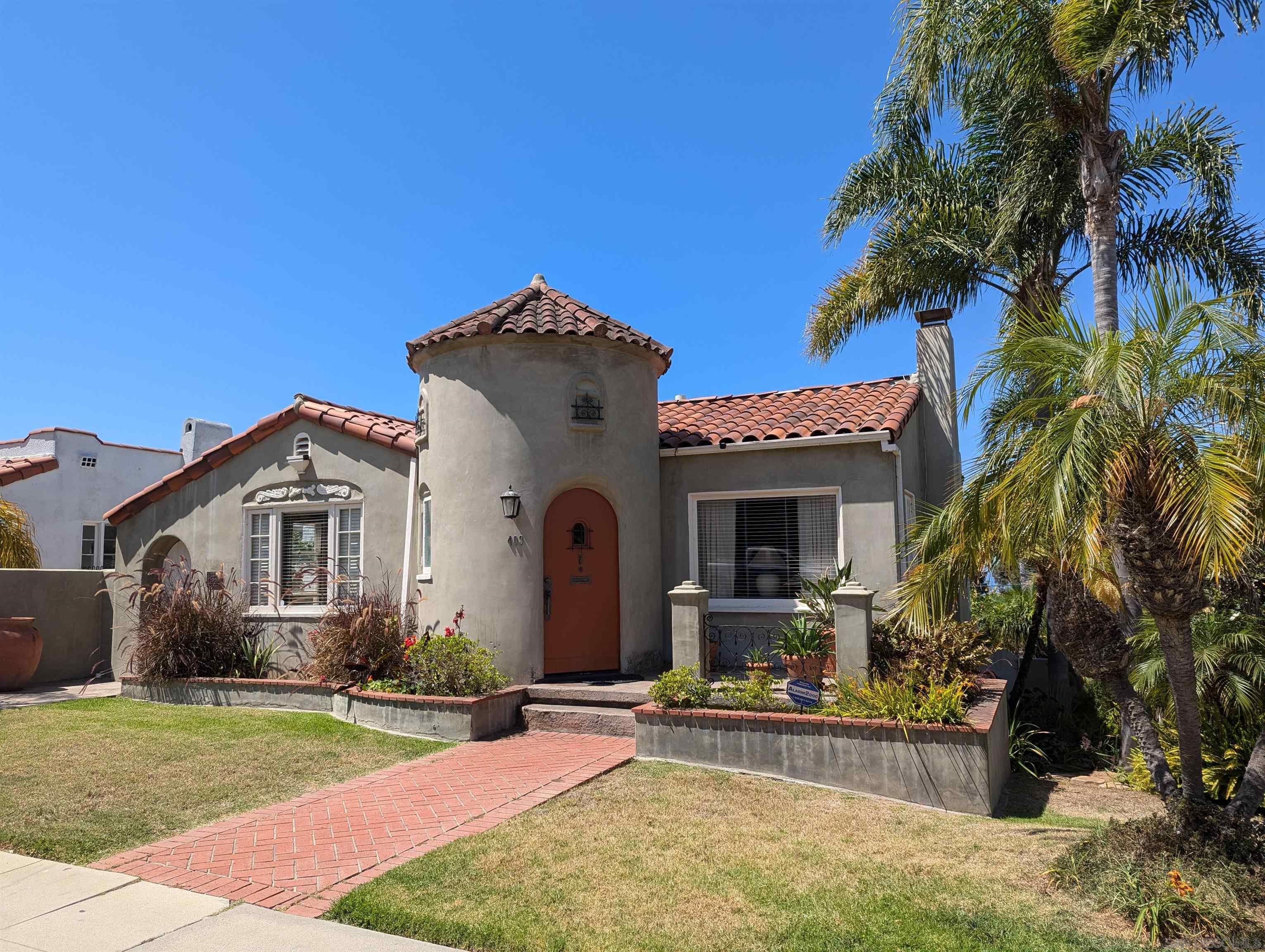 a front view of a house with garden