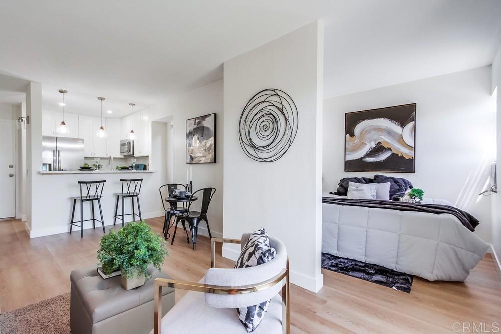 a living room with furniture and a clock