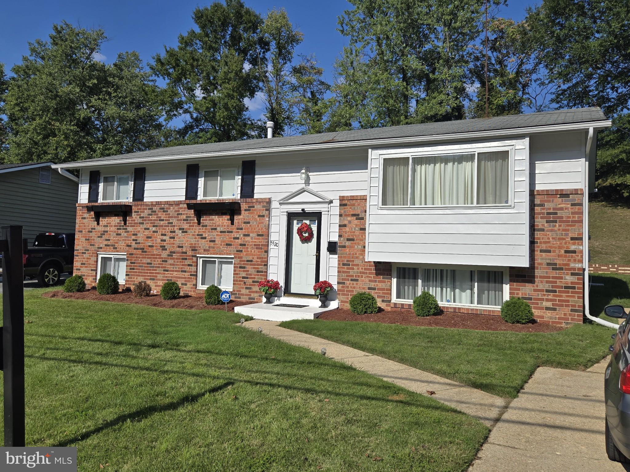 front view of a house with a yard