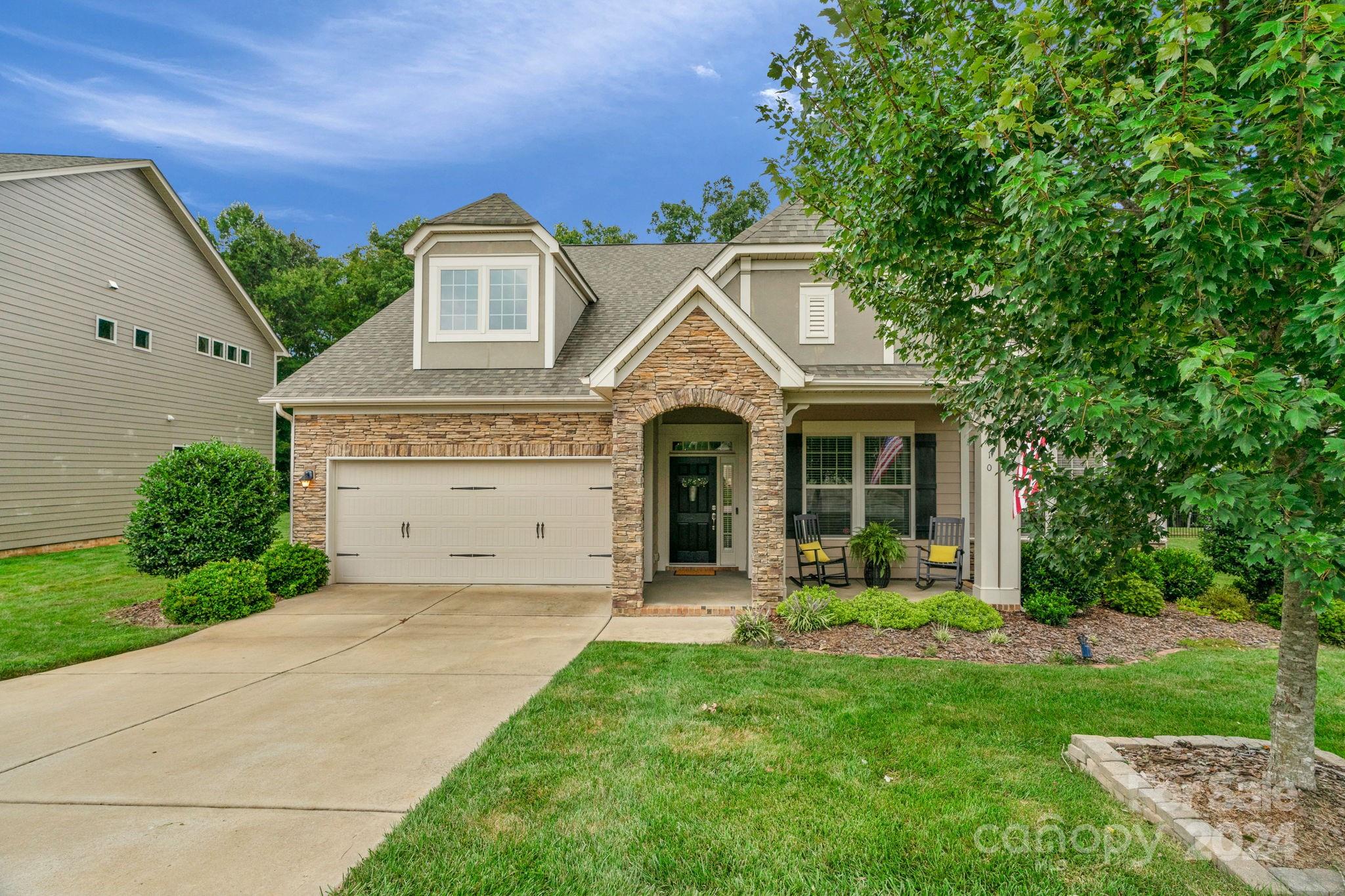 front view of a house with a yard