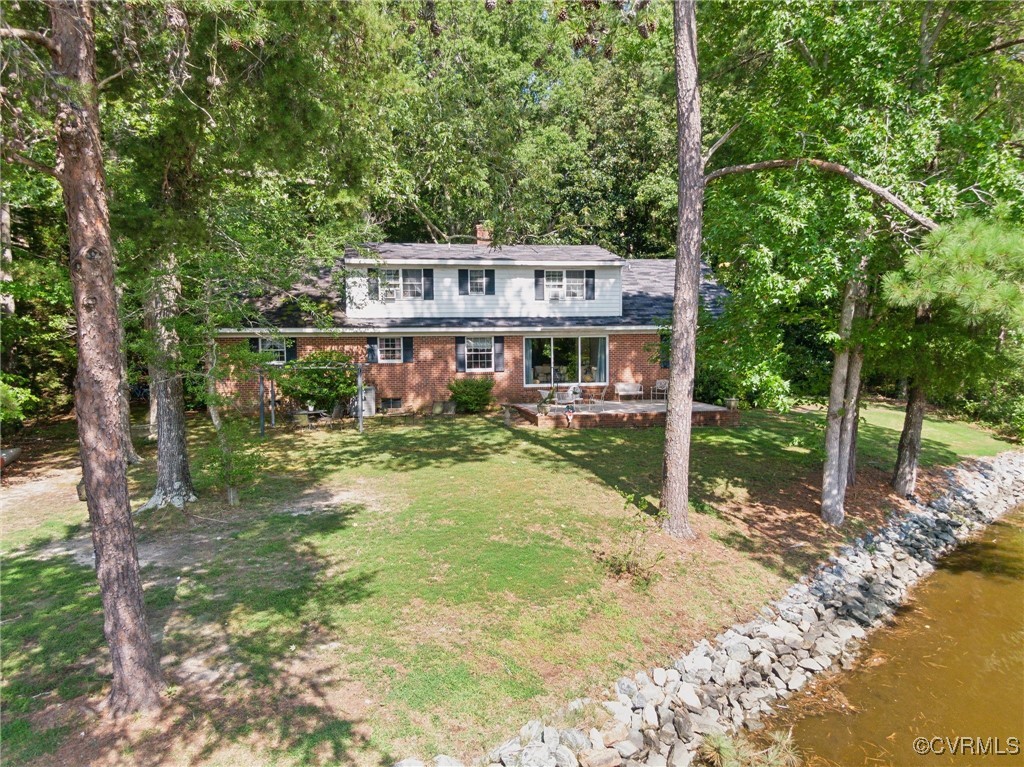 a view of a house with a yard balcony