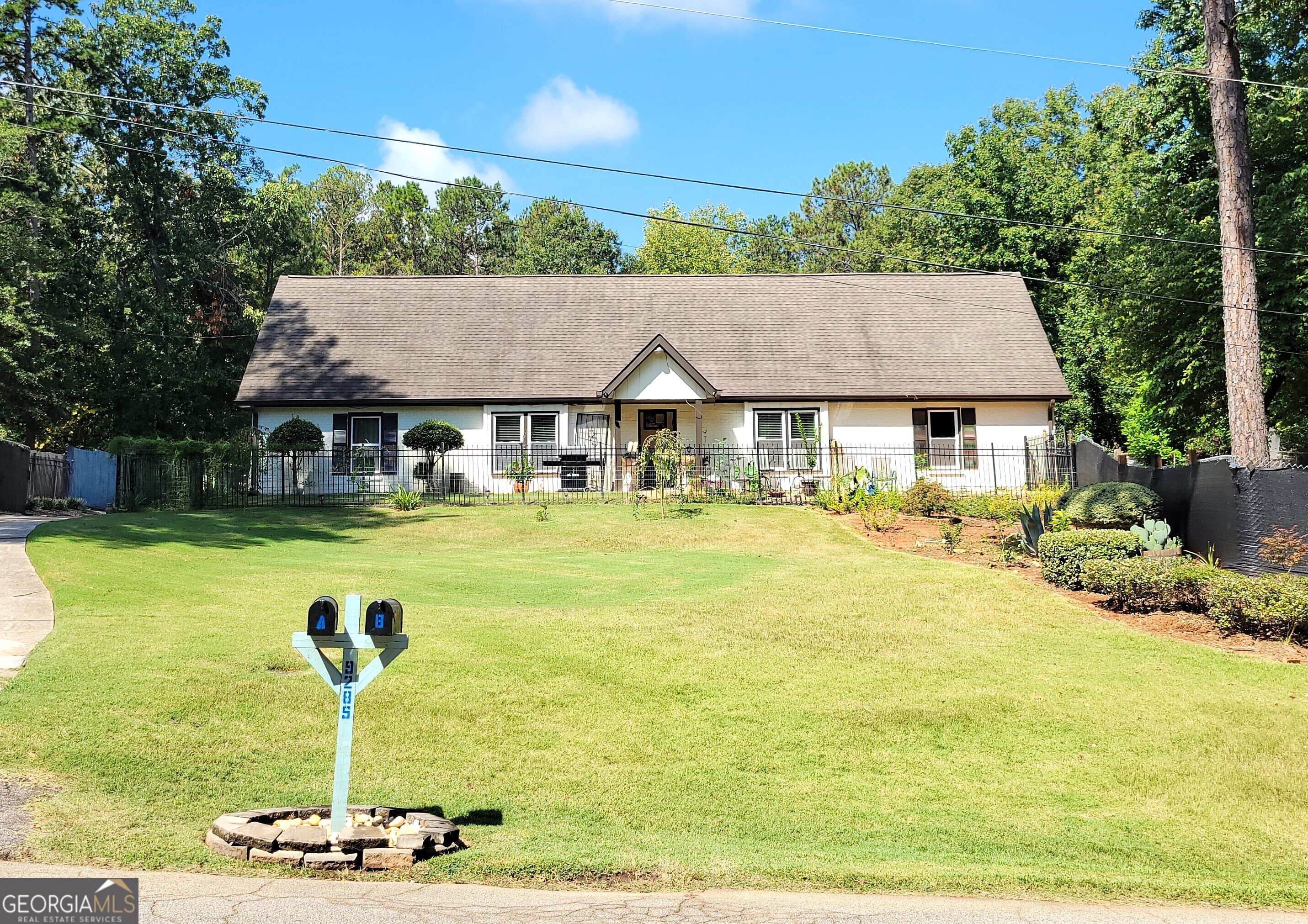 a front view of a house with swimming pool