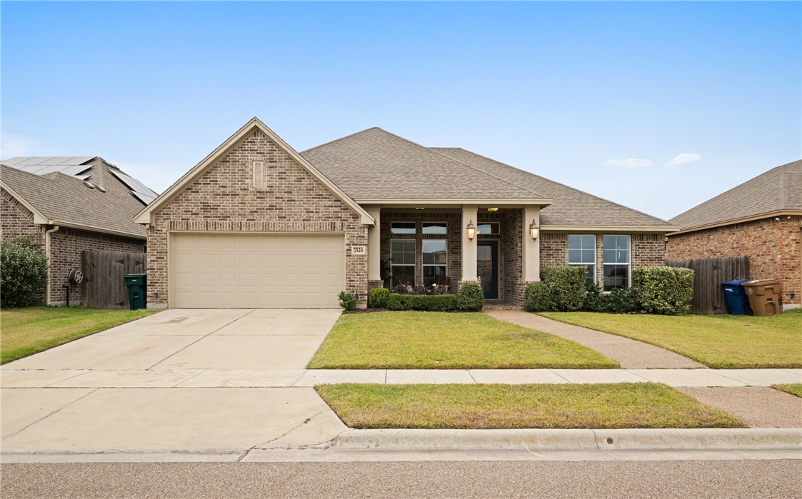 a front view of a house with yard