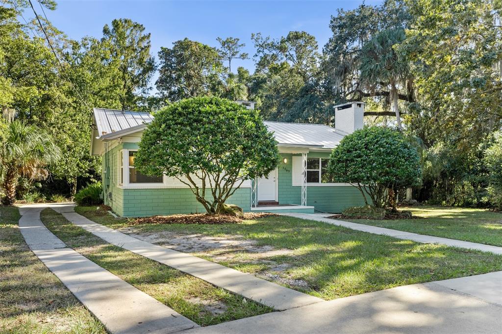 a view of a house with a yard