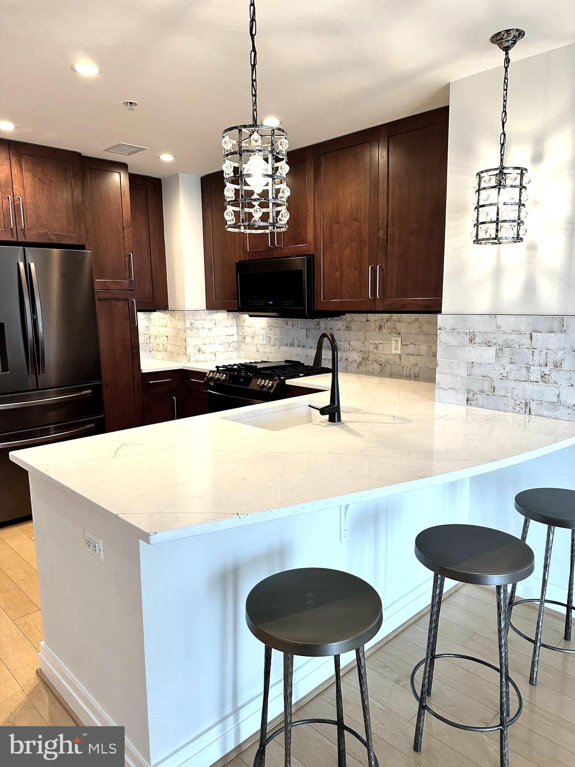 a view of a kitchen with granite countertop living room