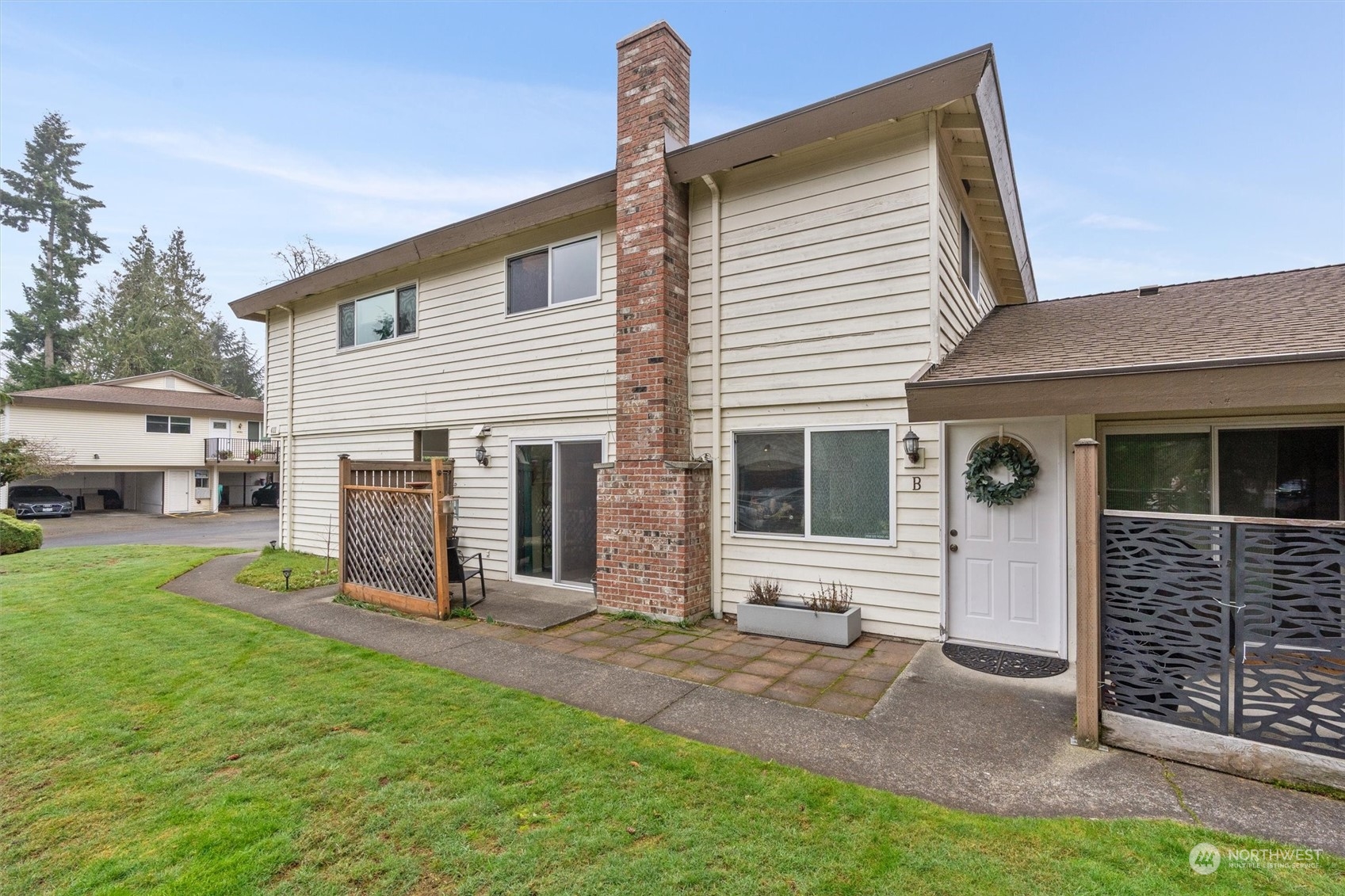 a view of a house with a yard