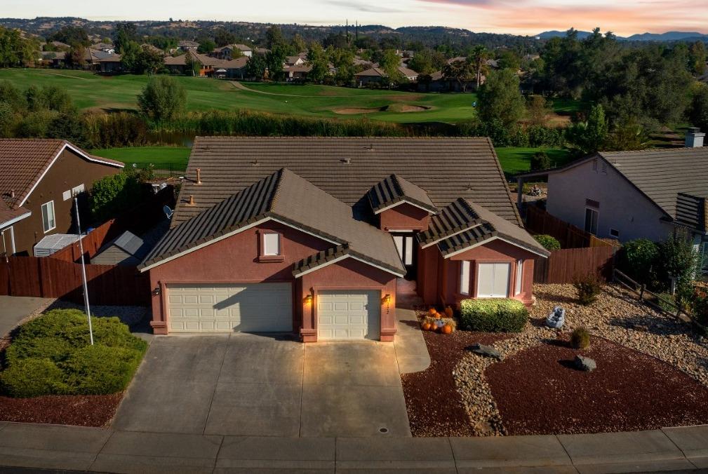 an aerial view of a house with a garden