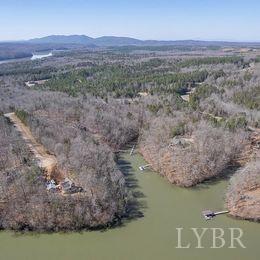 a view of a lake in middle of forest