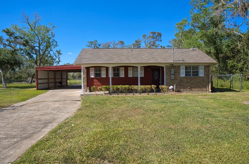 a view of a house with backyard porch and sitting area