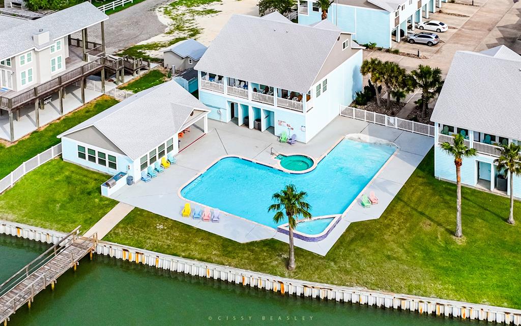 Discover the serene lifestyle at Gables of Copano Bay Condos with a pool overlooking the bay and a private fishing pier exclusive to residents.