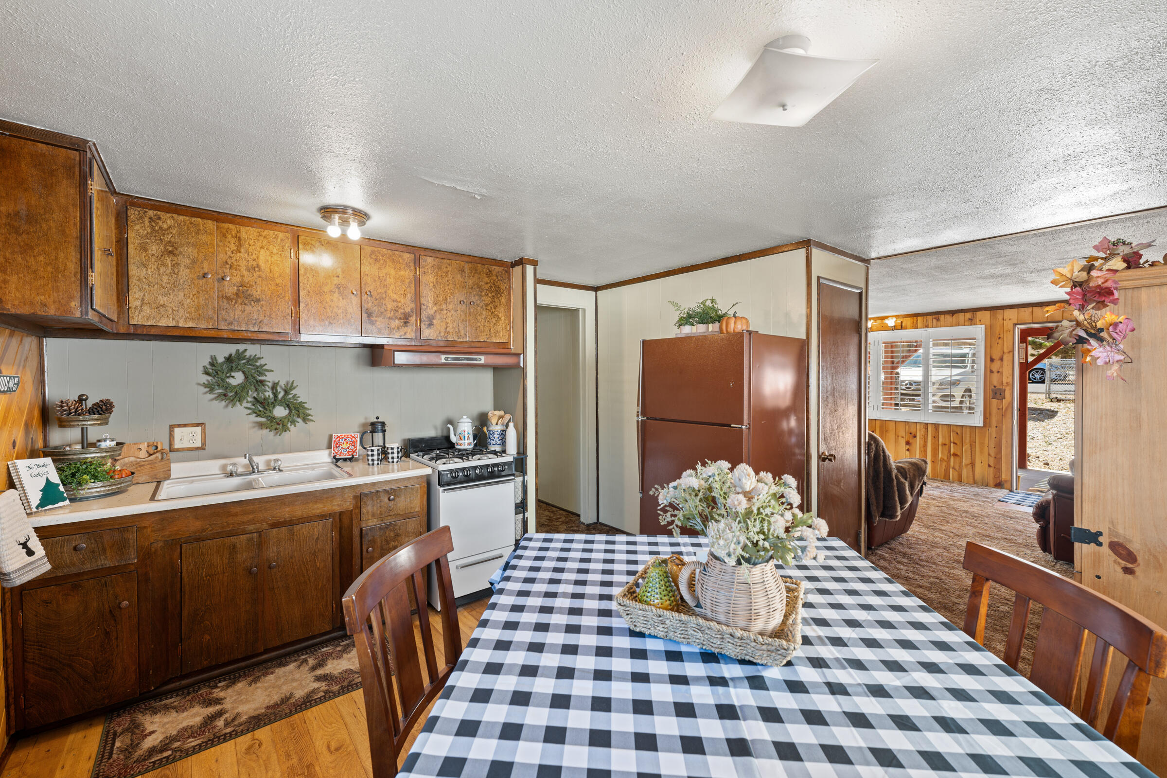 a kitchen with a sink stove and refrigerator