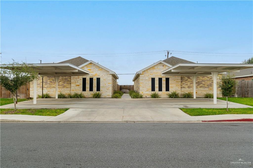 front view of a house next to a yard