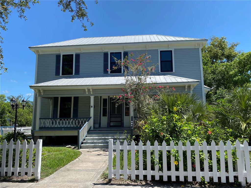 a front view of a house with a porch