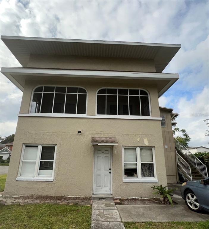 a front view of a house with parking space