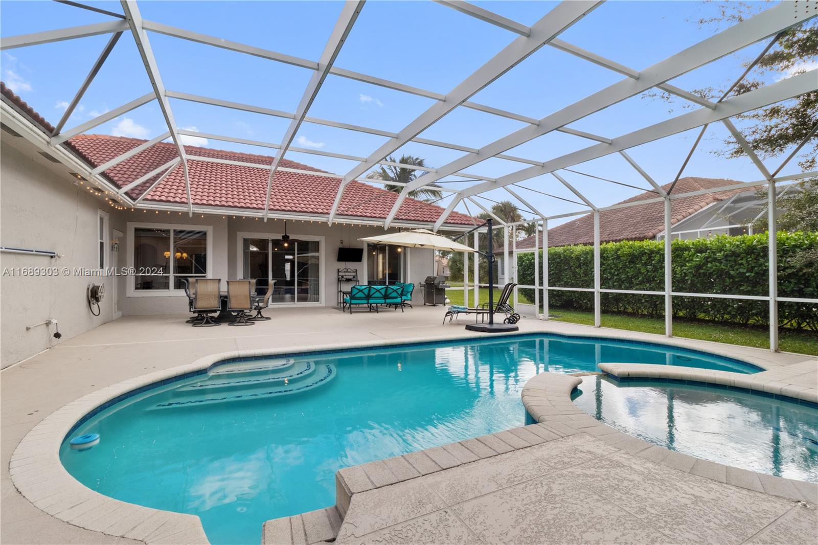 a view of a swimming pool with a patio