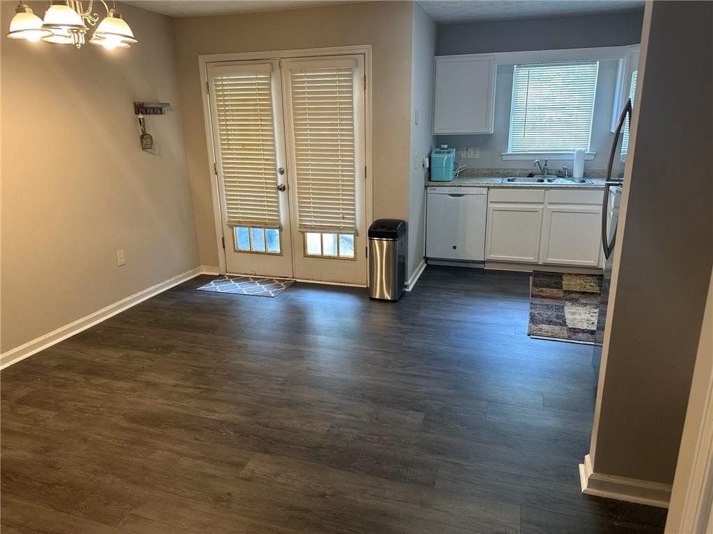 a view of kitchen with sink and wooden floor