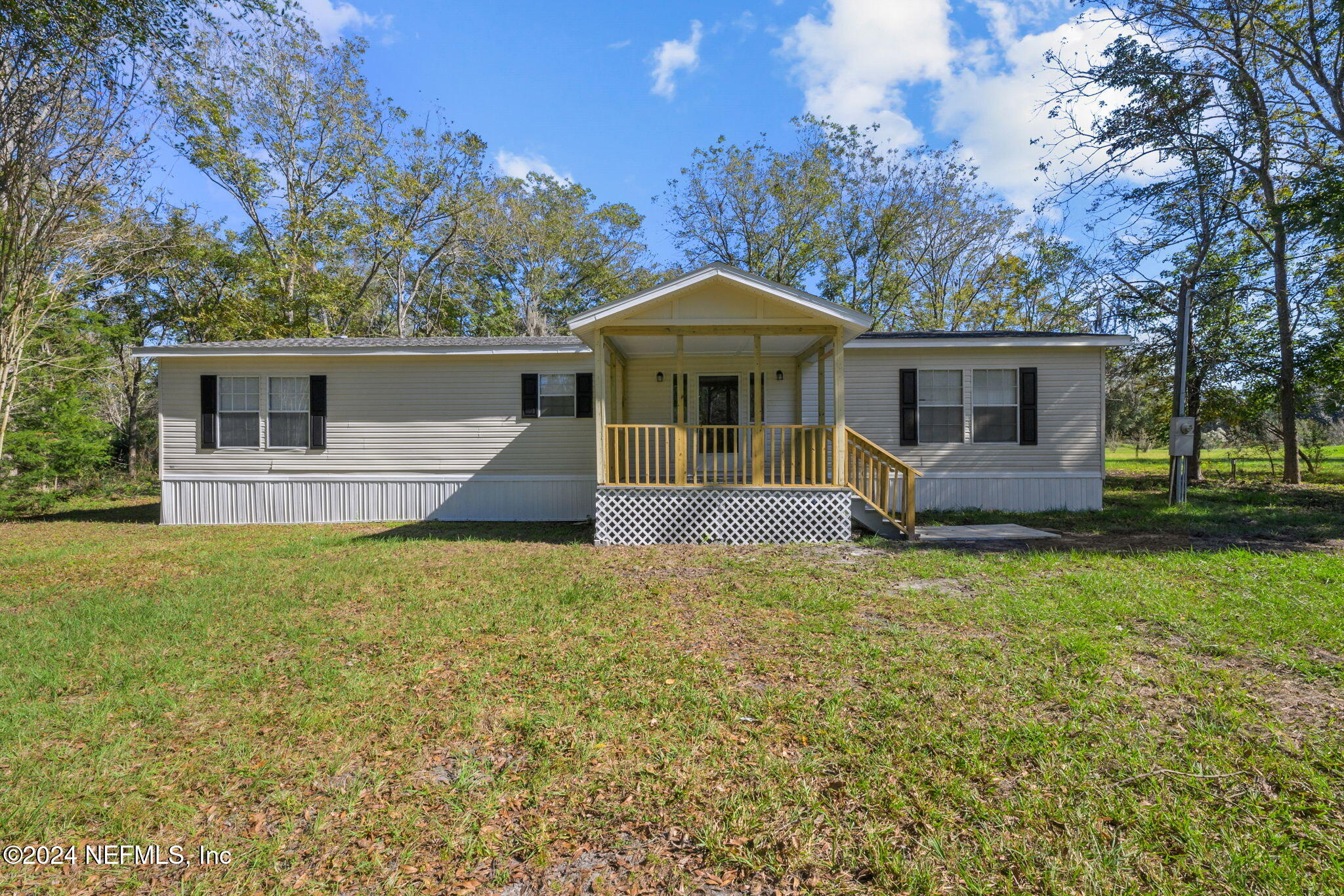 front view of a house with a yard