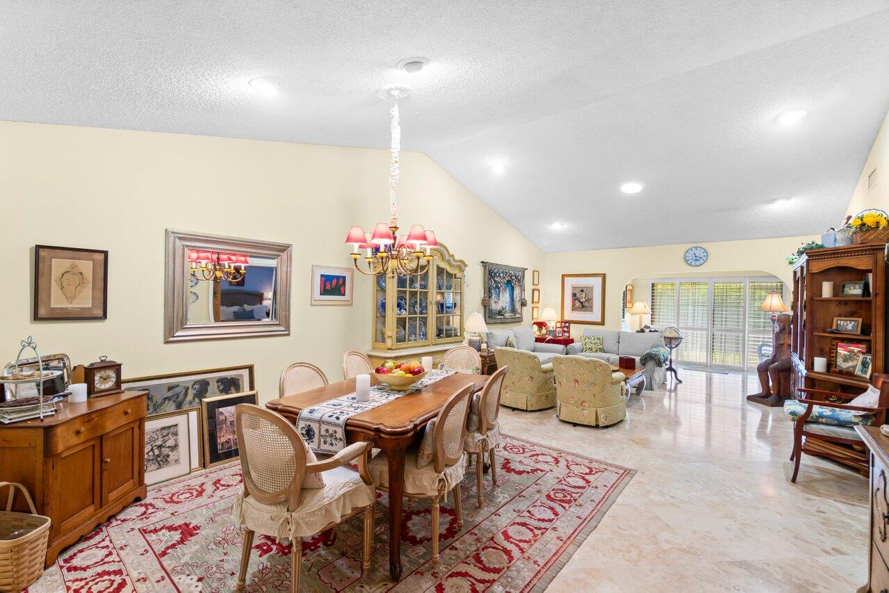 a living room with fireplace furniture and a wooden floor