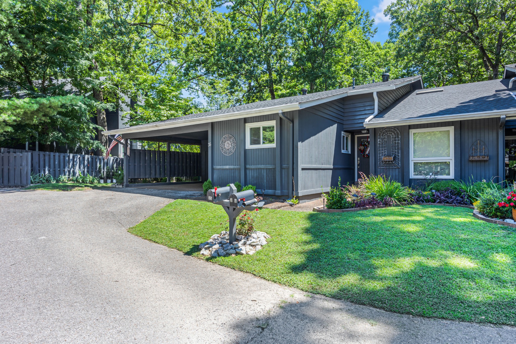 a front view of house with yard and green space