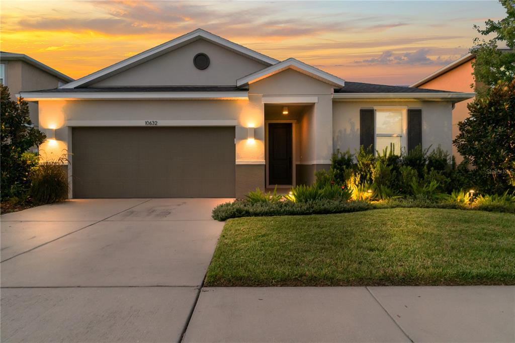 front view of a house with a yard