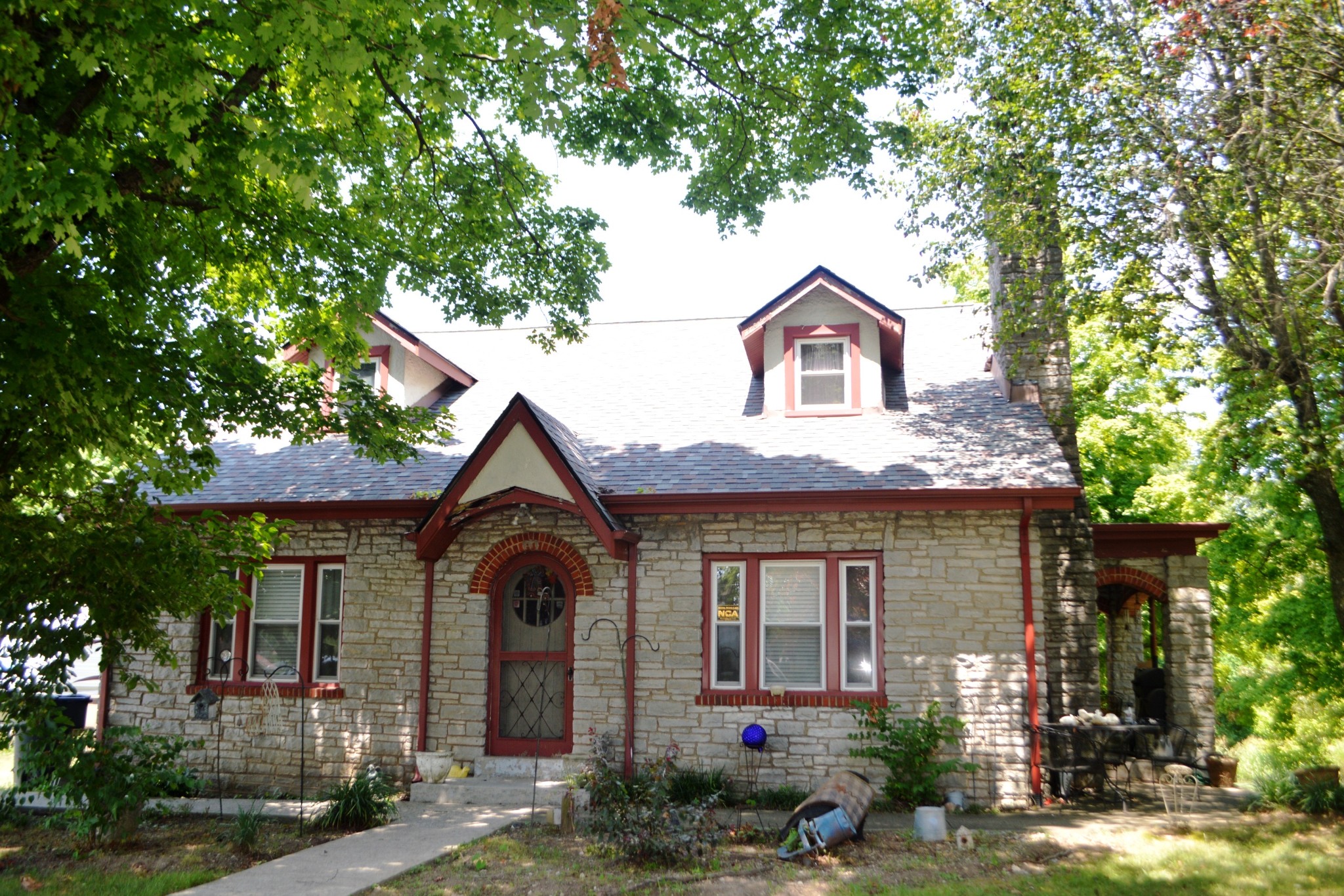 a front view of a house with garden