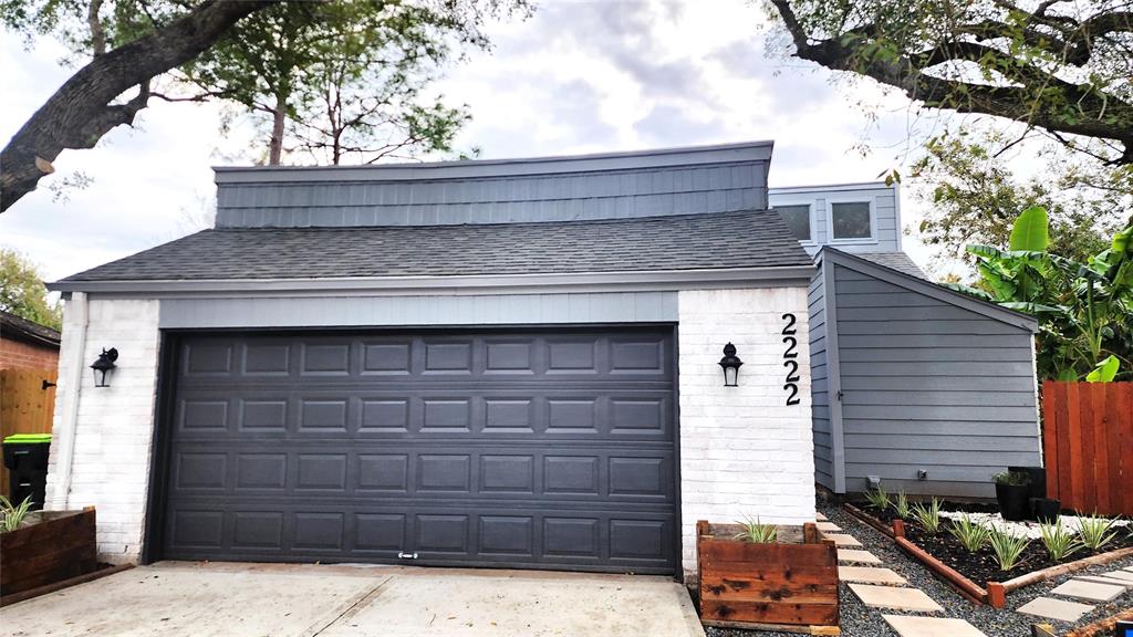 a front view of a house with garage