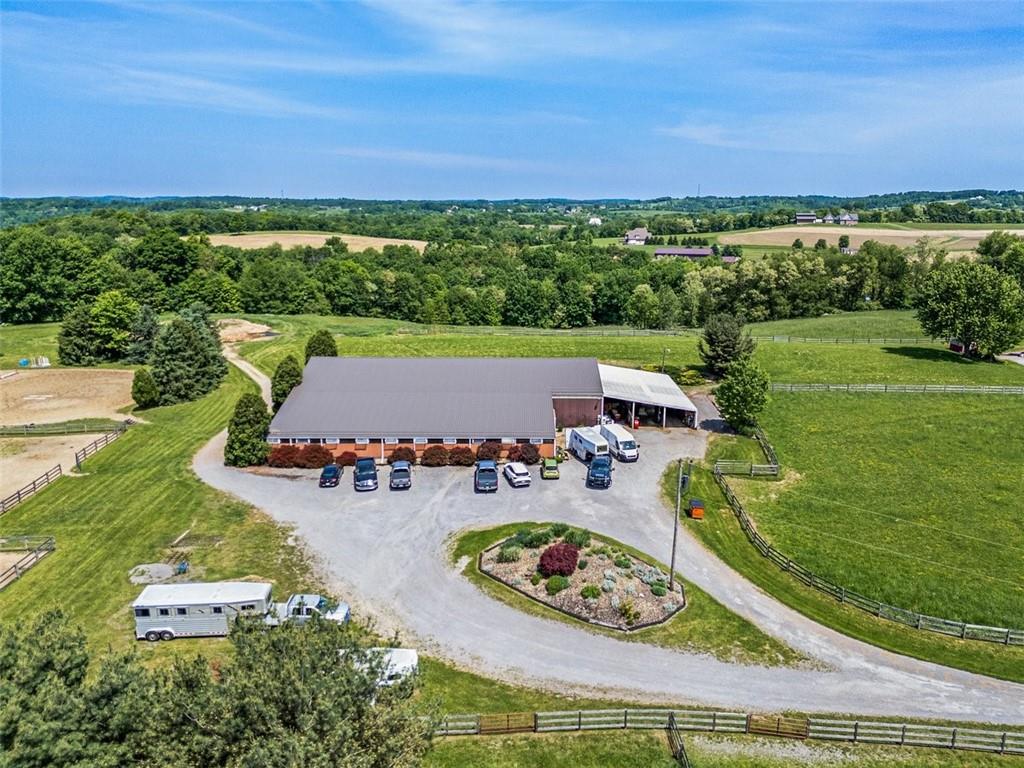 an aerial view of a house with outdoor space