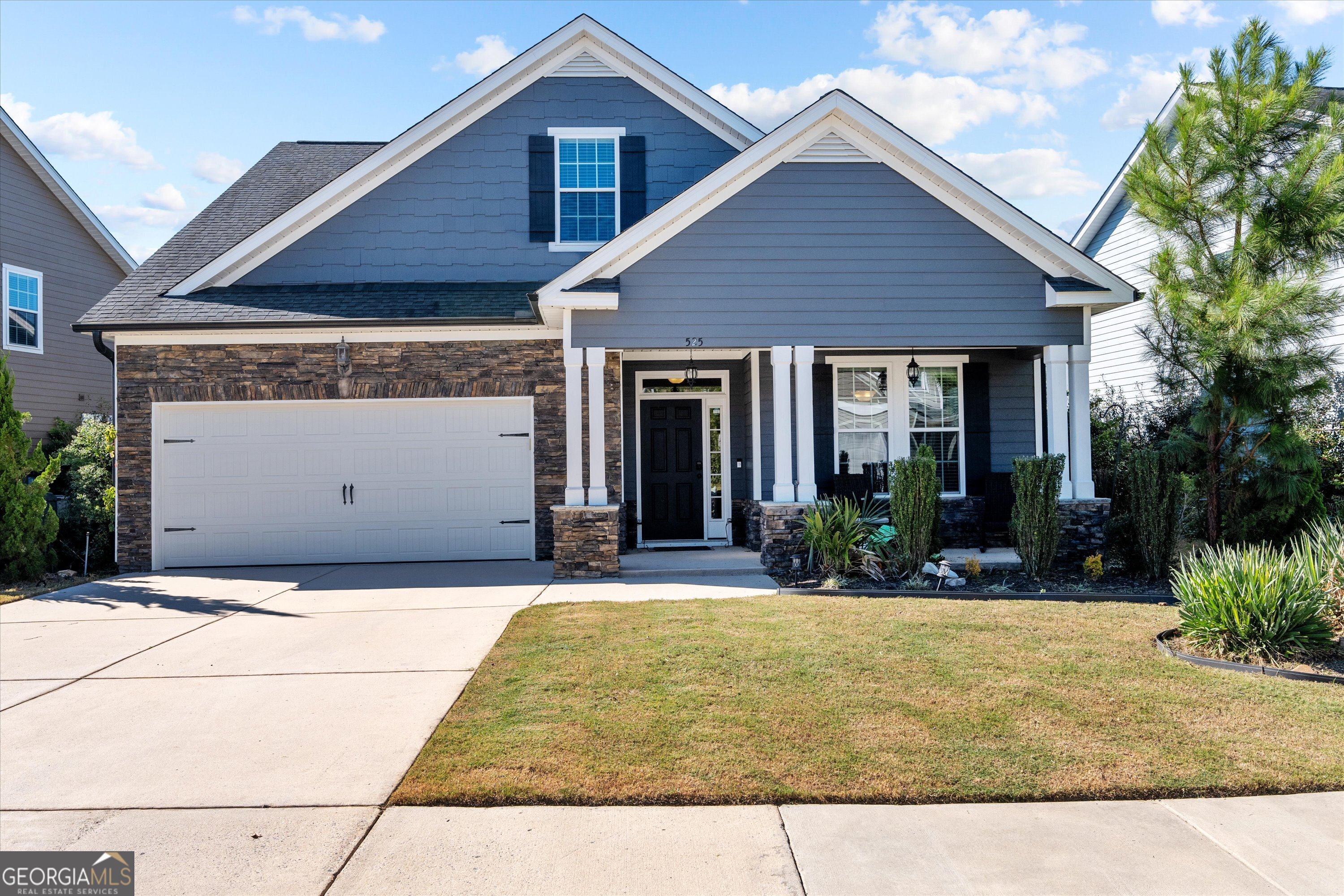 a front view of a house with a yard